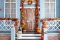 Halloween design home with yellow fall leaves and lanterns. House entrance staircase decorated for autumn holidays Royalty Free Stock Photo