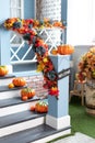 Halloween design home with yellow fall leaves and lanterns. House entrance staircase decorated for autumn holidays Royalty Free Stock Photo