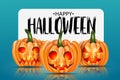 Halloween design with orange pumpkins with cut out glowing faces and a white banner sign with typography text on blue background. Royalty Free Stock Photo