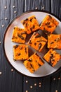 Halloween dessert cream Cheese Brownies consisting of a dark chocolate cake topped with a layer of orange cheesecake Royalty Free Stock Photo