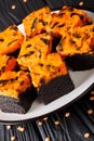 Halloween dessert cream Cheese Brownies consisting of a dark chocolate cake topped with a layer of orange cheesecake Royalty Free Stock Photo