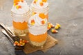 Halloween dessert in a jar layered candy corn parfait Royalty Free Stock Photo