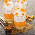 Halloween dessert in a jar layered candy corn parfait