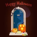 Halloween door decorations with pumpkins in night