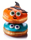 Halloween doughnuts with eyes and pumpkin isolated over white background Royalty Free Stock Photo