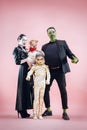 Halloween Family. Happy Father, Mother and Children Girls in Halloween Costume and Makeup