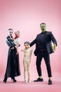 Halloween Family. Happy Father, Mother and Children Girls in Halloween Costume and Makeup