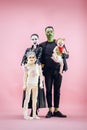 Halloween Family. Happy Father, Mother and Children Girls in Halloween Costume and Makeup