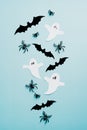 Halloween flat lay composition with ghosts, spiders, bats on blue background. Flat lay, top view, overhead Royalty Free Stock Photo