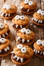 Halloween food: monsters of nutty cookies with chocolate cream c Royalty Free Stock Photo