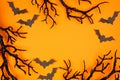 Halloween frame of spooky bats and black branches over an orange background Royalty Free Stock Photo