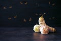 Halloween Fruit Mummy. Funny Scared orange, apple and banana with eyes and wrapped in bandages on dark background. Halloween DIY c Royalty Free Stock Photo