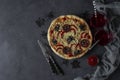 Halloween funny pizza with spiders, Creative idea for Halloween pizza on dark gray background with drinks and