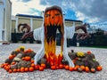 Halloween ghost made of Pumpkins rustic hay decoration outdoors. Stylish autumn decor of exterior building. Rural decor Royalty Free Stock Photo