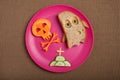 Halloween ghost and skull made of bread and carrot