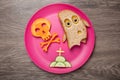 Halloween ghost and skull made of bread and carrot