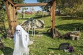 Halloween ghost with two skeletons on swing