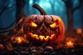 Halloween glowing pumpkin in autumn gloomy forest at night Royalty Free Stock Photo