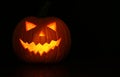 Halloween glowing pumpkin on black