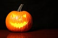 Halloween glowing pumpkin on black