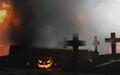 Halloween graveyard open coffin with cross in fire and fog 3d-illustration