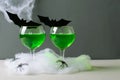 Halloween Green Cocktail, Toxic Drink Decorated with Spiders, Cobweb and Black Bats on Dark Background Royalty Free Stock Photo