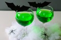 Halloween Green Cocktail, Toxic Drink Decorated with Spiders, Cobweb and Black Bats on Dark Background Royalty Free Stock Photo