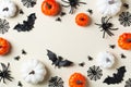 Halloween greeting card with bats, spiderweb, spider, skull and pumpkins