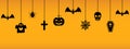 Halloween hanging ornaments on orange background