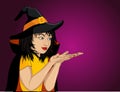 Halloween.Happy woman in hat and witch costume showing a gesture Royalty Free Stock Photo