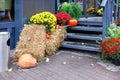 Halloween has decorated the cafÃ¯Â¿Â½`s entrance steps with pumpkins, straw bales and fall flowers Royalty Free Stock Photo