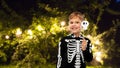 Boy in halloween costume of skeleton making faces Royalty Free Stock Photo