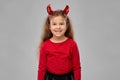 Girl in halloween costume and devil`s horns Royalty Free Stock Photo