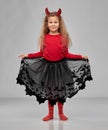 Girl in halloween costume and devil`s horns Royalty Free Stock Photo