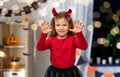 girl costume with devil's horns on halloween Royalty Free Stock Photo