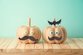 Halloween holiday concept with cute funny pumpkin decor on wooden table Royalty Free Stock Photo