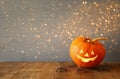 Halloween holiday concept. Cute pumpkin on wooden table Royalty Free Stock Photo