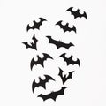 Halloween holiday concept. Handmade black bats on white background. Flat lay, top view.