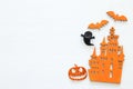 Halloween holiday concept over white wooden background. Top view, flat lay.