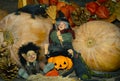 Halloween holiday concept photo.Cute pumpkins and witch.