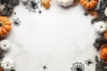 Halloween holiday concept - yellow and red dried leaves and small orange pumpkins on white background, top view, copy space,