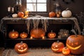 halloween holiday decoration with pumpkins, autumn leaves and candles, still life, cozy, festive background Royalty Free Stock Photo