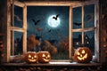 halloween holiday decorations, jack o lantern pumpkins and candles on a windowsill, flying bats outside the window, moonlit night Royalty Free Stock Photo