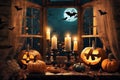 halloween holiday decorations, jack o lantern pumpkins and candles on a windowsill, flying bats outside the window, moonlit night Royalty Free Stock Photo