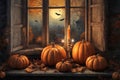 halloween holiday decorations, jack o lantern pumpkins and candles on a windowsill, flying bats outside the window, moonlit night Royalty Free Stock Photo