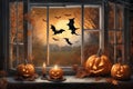 halloween holiday decorations, scary jack o lantern pumpkins and candles on a windowsill, flying bats outside the window, moonlit Royalty Free Stock Photo