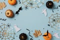 Halloween holiday frame with pumpkins, bats, spider web and ghosts. Happy halloween greeting card flat lay style Royalty Free Stock Photo