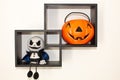 Halloween home accessories, a pumpkin with sweets and a ghostly monster doll
