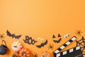 Halloween horror movie night background  with  pumpkin, decorations and movie clapper board. Top view, flat lay Royalty Free Stock Photo