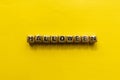 Halloween inscription on the cubes. Halloween title with yellow background